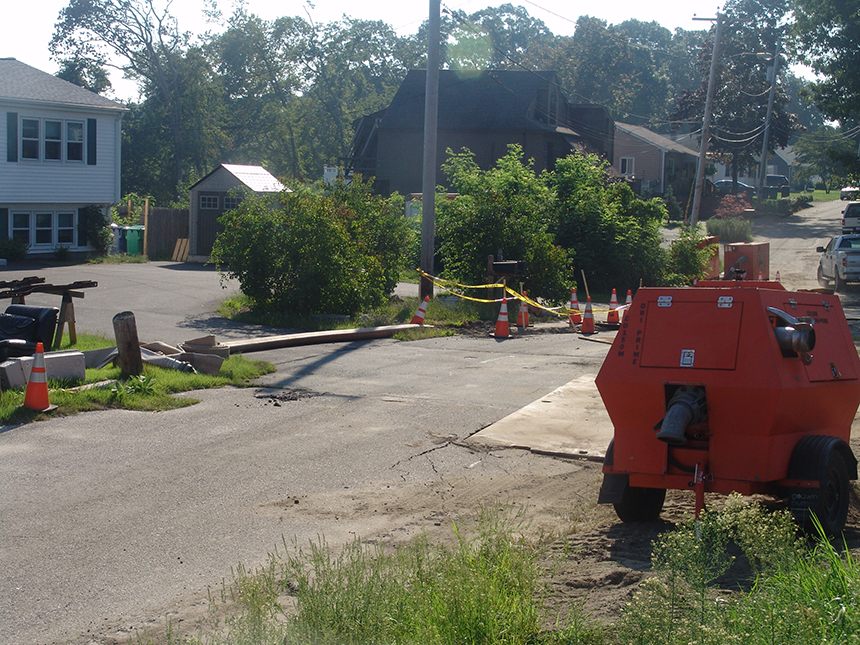  The Cedar Swamp Road worksite in Warwick, R.I., has been bustling with workers and equipment since a sewer line collapsed a week ago. (Frank Carini/ecoRI News photos) 